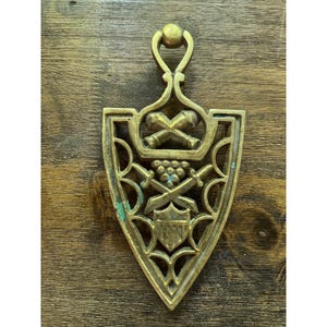 Vintage Brass Trivet Shield Crossed Cannons Swords Grapes Wall Hanging Decor 9in