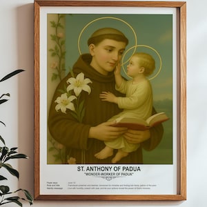 May include: A vintage-style illustration of Saint Anthony of Padua, a Catholic saint, holding a book and a small child. The image is framed in a wooden frame and has a white background. The text "ST. ANTHONY OF PADUA" and "WONDER-WORKER OF PADUA" is printed below the image.