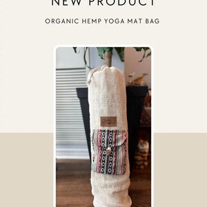 May include: A beige hemp yoga mat bag with a patterned pocket and a brown leather tag that says "Hemp Karma".