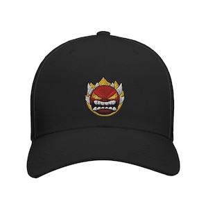 May include: Black baseball cap with an embroidered red and yellow cartoon face with a menacing expression.