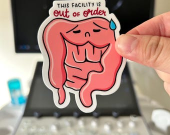 May include: A pink cartoon intestine with a sad face and a sweat drop. The intestine is holding a sign that says "This facility is out of order".