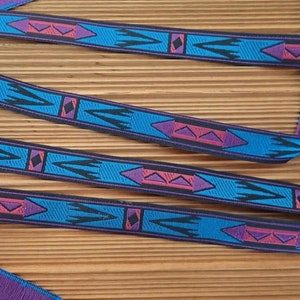 APACHE narrow Jacquard trim in cadet blue, purple, red and black. Sold by the yard. 7/16 inch wide. 995-C. South Western trim