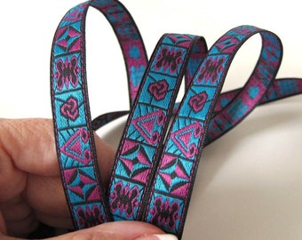 ADINKRA narrow Jacquard trim in fuchsia, black on turquoise. Black edges. Sold by the yard. 1/2 inch wide. 2015-B. African pattern