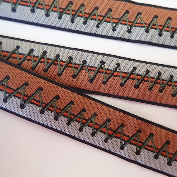 Steampunk TIE IT UP Jacquard trim in mocha, ivory, olive and rust. Sold by the yard. 3/4 inch wide. 2104-A. Zipper tape, corset ties