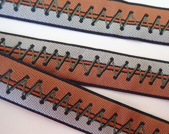 TIE IT UP Jacquard trim in mocha, ivory, olive and rust. Sold by the yard. 3/4 inch wide. 2104-A. Zipper tape, corset ties, bondage