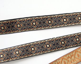 BRONZE AGE narrow Jacquard trim in brown and tan on black. Sold by the yard. 5/8 inch wide. 582-C  Geometric trim