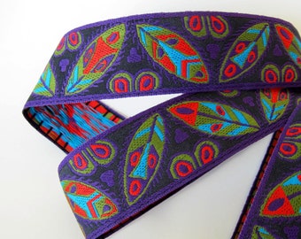MASKS and SHIELDS Jacquard trim turquoise, red, olive green on purple. Sold by the yard. 1 5/8 inch wide. 134-E. African warrior, ethnic