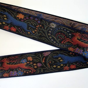 STAG and BLUE WOLF Jacquard tapestry strap in bronze, blue, purple, yellow on black. Navy edges. 2 1/4 inches wide. 2093-A. Middle Age