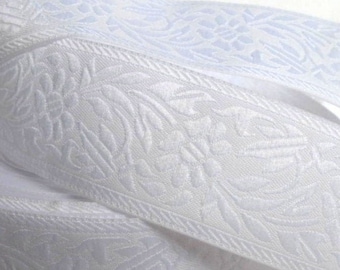 White on white FLORAL CAMEO embroidered Jacquard trim. Sold by the yard. 1 1/8 inch wide. 998-E. Bridal trim