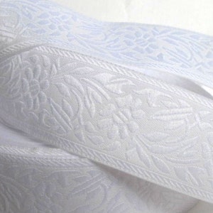 White on white FLORAL CAMEO embroidered Jacquard trim. Sold by the yard. 1 1/8 inch wide. 998-E. Bridal trim
