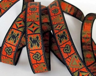 May include: Orange, green, and black patterned ribbon with a geometric design. The ribbon is woven and has a subtle sheen.