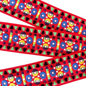 Red FOUR WHEELS wide Jacquard trim. Blue, green, yellow, black on red. 2 inch wide. 250-C. Classic guitar strap trim, Vintage jacquard trim