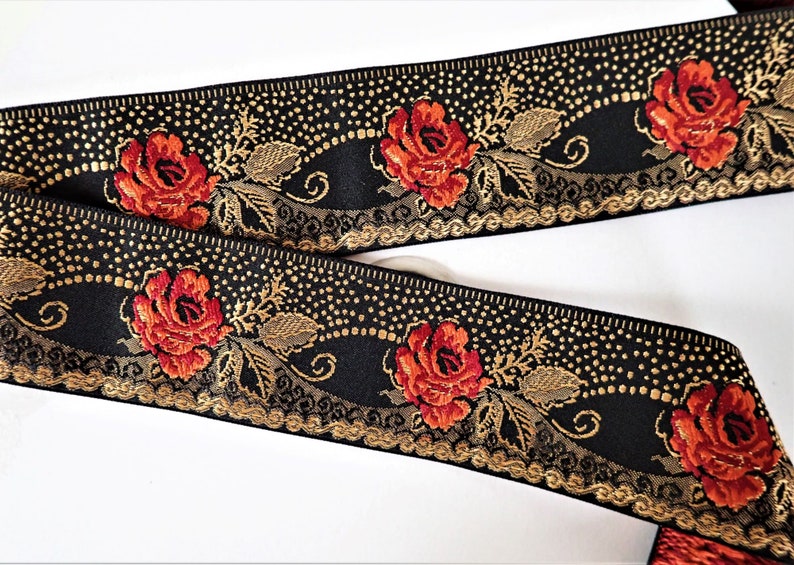 deep red roses on a black jacquard trim with gold details in pointille