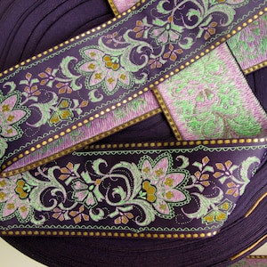 wide purple textile jacquard ribbon trim with rich florals in green, mustard yellow, lavender mauve and metallic gold threads, over 2 inches wide