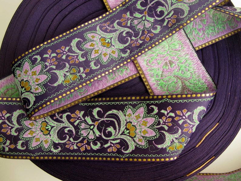 wide purple textile jacquard ribbon trim with rich florals in green, mustard yellow, lavender mauve and metallic gold threads, over 2 inches wide