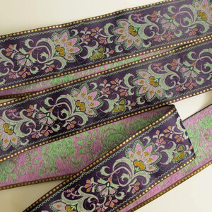 wide purple textile jacquard ribbon trim with rich florals in green, mustard yellow, lavender mauve and metallic gold threads, over 2 inches wide