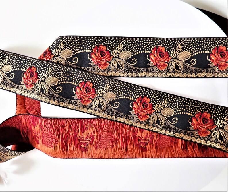 deep red roses on a black jacquard trim with gold details in pointille
