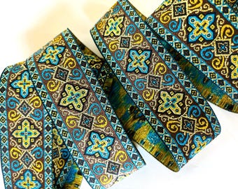 LITURGY Jacquard trim. Gold, mustard, turquoise, black, on dark brown. Sold by the yard. 1 1/2 inch wide. 704-C