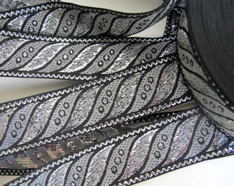 SLANTED LEAVES Jacquard trim in gunmetal grey, silver, on black. Sold by the yard. 1 inch wide. 187-G brocade ribbon trim. Regency trim