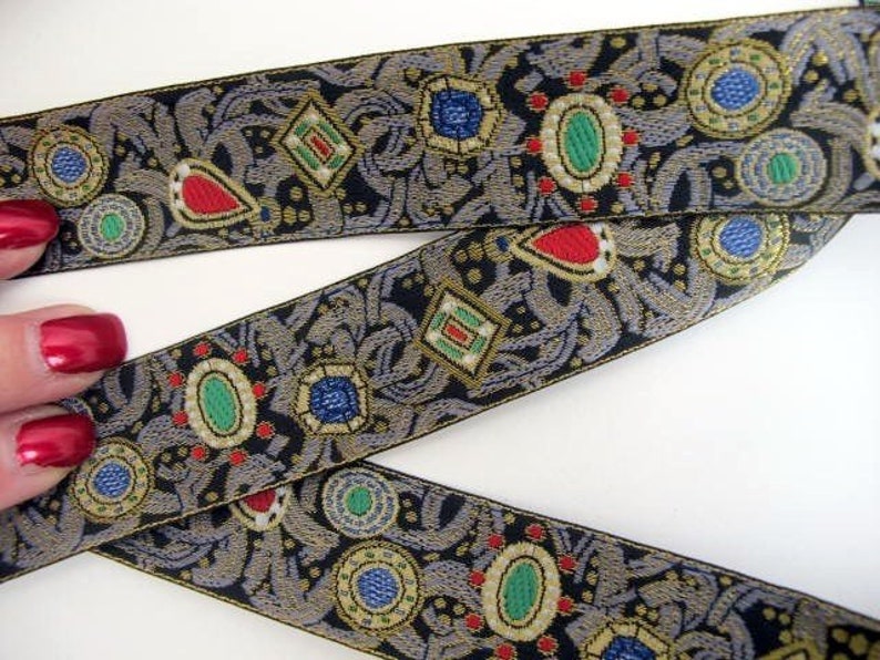 JEWELS medium Jacquard trim. Red, emerald green, sapphire blue, slate grey, white, gold, on black. Sold by the yard. 1 1/8 inch wide. 870-A image 1