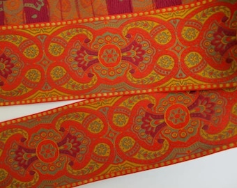 ESCARBUNCLE Jacquard trim in wine red, mustard, olive green, gold, on orange. Sold by the yard. 2 1/4 inch wide. 732(2)-C