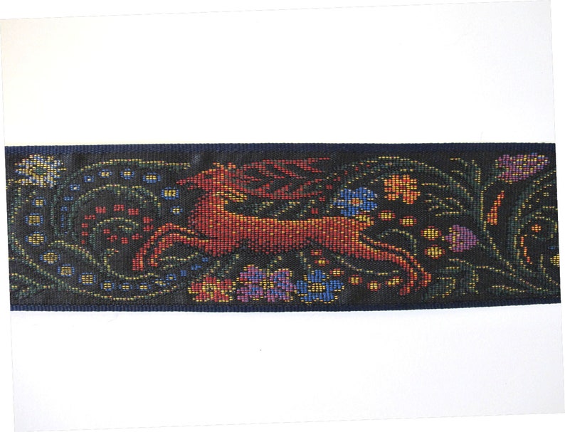 Medieval tapestry wide Jacquard trim with a brown stag and a blue wolf in a floral garden on a black background