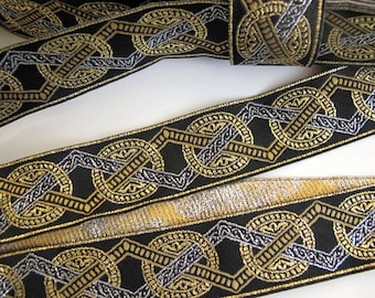 VIKING MEDALLION Jacquard trim in silver, gold, bronze on black. Sold by the yard. 1 1/8 inch wide. 286-A