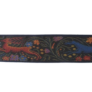 Medieval tapestry wide Jacquard trim with a brown stag and a blue wolf in a floral garden on a black background