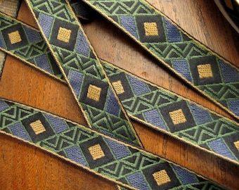 Pre-cut WARLORD odd lengths Jacquard trim pieces in mustard, blue, olive green, on black. 3/4 inch wide.851-B. A geometric trim, remnants