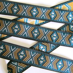 ARIZONA Jacquard trim in teal green, mustard, slate grey on black. Sold by the yard. 1 1/8 inch wide. 2062-A tribal trim