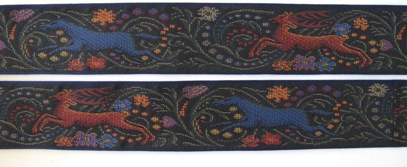 Medieval tapestry wide Jacquard trim with a brown stag and a blue wolf in a floral garden on a black background