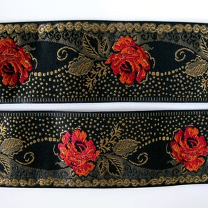 deep red roses on a black jacquard trim with gold details in pointille