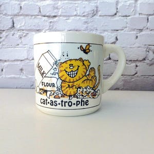 Catastrophe Cat Mug Orange Ginger Tabby Cat Funny Clumsy Kitty Cup Coffee Mug Cute Gift for Cat Lover Friend Vintage 1980s Grant Howard 1982