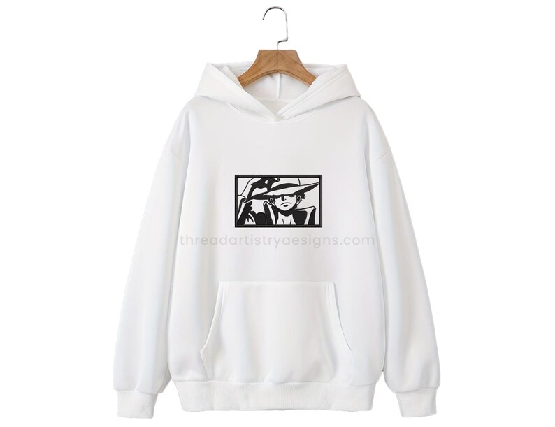 May include: White hoodie with a black and white illustration of a cartoon character wearing a hat. The text "threadartistrydesigns.com" is printed on the bottom of the hoodie.