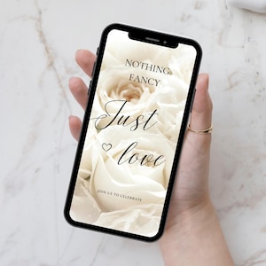 May include: A smartphone displaying a wedding invitation with a white rose background and the text "Nothing Fancy Just Love" and "Join Us To Celebrate".
