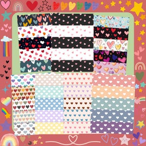 Könnte beinhalten: Eine Sammlung von Washi-Tapes mit verschiedenen Herzmustern. Die Tapes zeigen eine Vielzahl von Farben, darunter Rot, Rosa, Blau und Lila, mit unterschiedlichen Herzmustern auf jeder Rolle. Der Hintergrund ist ein weiches Rot mit dekorativen Herzen und Sternen.