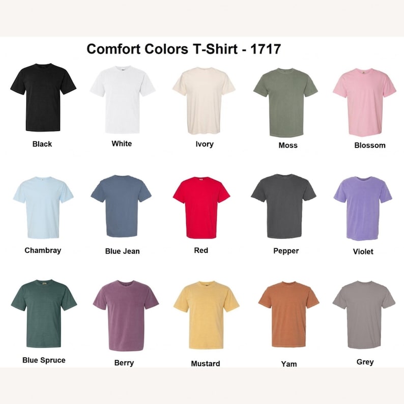 Op de afbeelding: Een display van Comfort Colors T-shirts in diverse kleuren, waaronder zwart, wit, ivoor, mos en bloesem. Extra kleuren zijn chambray, blue jean, rood, peper, violet, blue spruce, bes, mosterd, yam en grijs. De tekst "Comfort Colors T-Shirt - 1717" staat bovenaan.