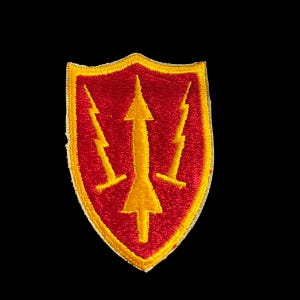 May include: A shield-shaped embroidered patch featuring a red background with a yellow border. Centered on the patch is a yellow vertical arrow pointing upward, flanked by two yellow lightning bolts, one on each side of the arrow.