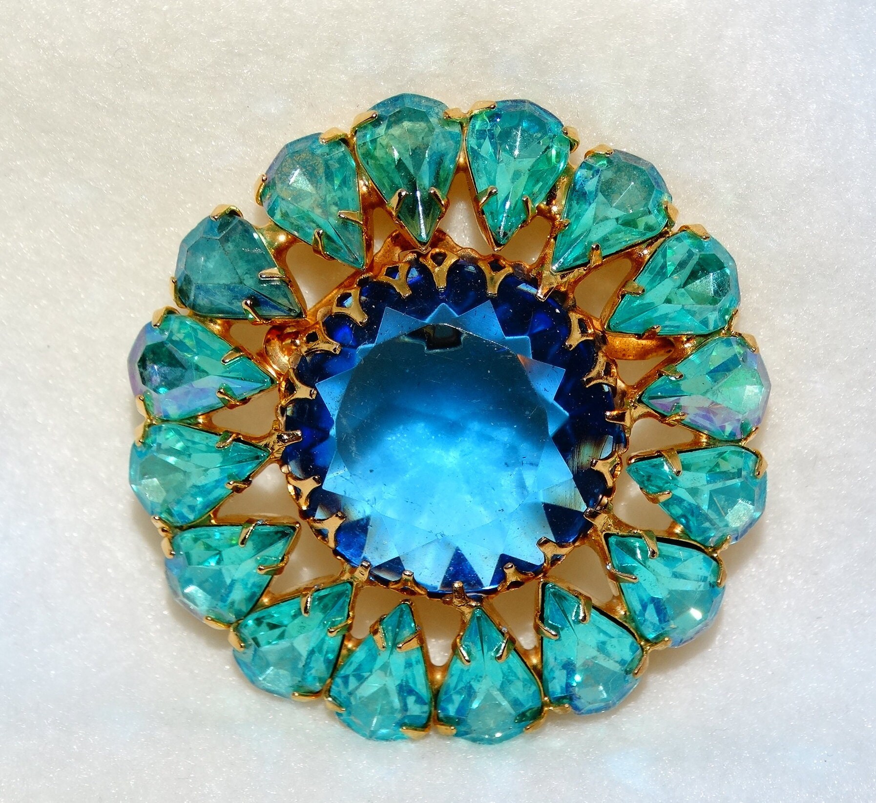 Aqua Open Flower Brooch with Aqua Blue and Green Rhinestones in The Center of Lovely Curled Petals Lined with Clear Rhinestones
