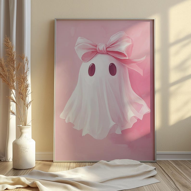 May include: A pink and white ghost with a pink bow on its head. The ghost is on a pink background.