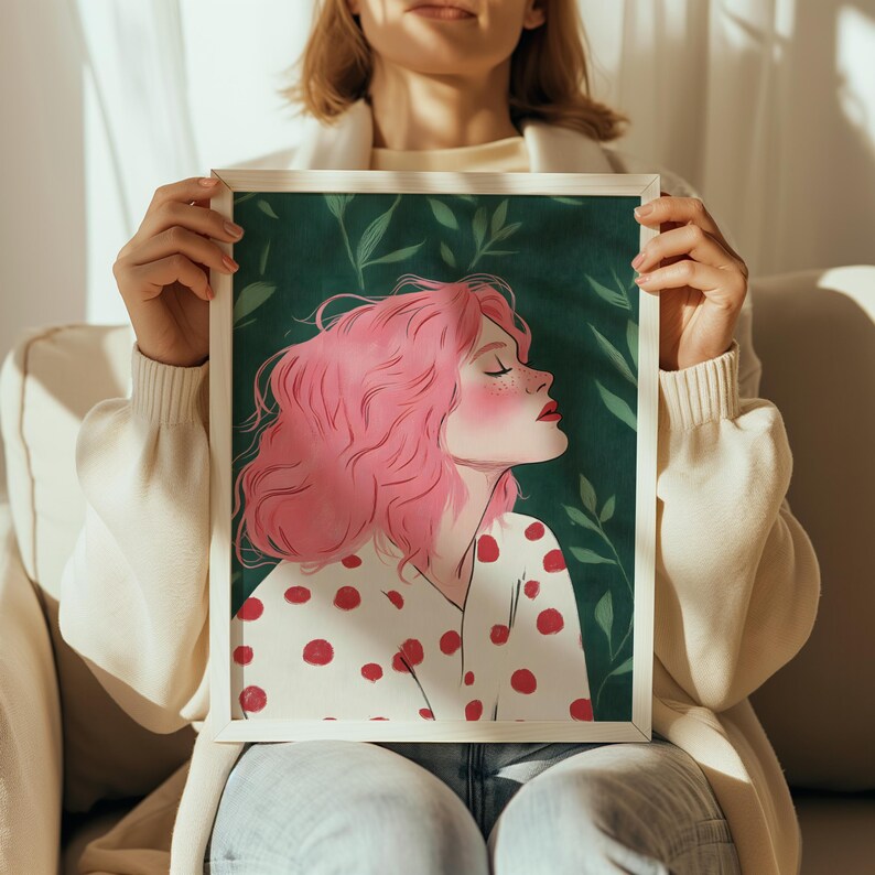 May include: A framed illustration of a woman with pink hair wearing a white shirt with red polka dots. The background is a green leafy pattern.