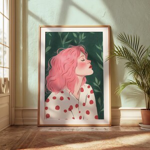 May include: A woman with pink hair and a white shirt with red polka dots is pictured against a green background with leaves. She has her eyes closed and is smiling.
