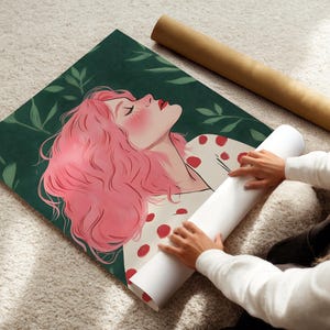 May include: A digital illustration of a woman with pink hair and red polka dots on her white shirt. She is lying down with her eyes closed and her head tilted back. The background is a dark green with leaves.
