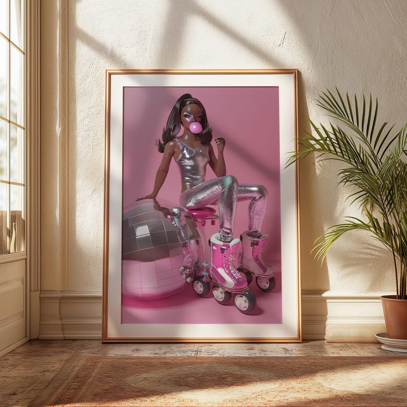 May include: A black doll wearing a silver jumpsuit and roller skates sits on a pink disco ball. The doll is blowing a pink bubble. The background is pink.