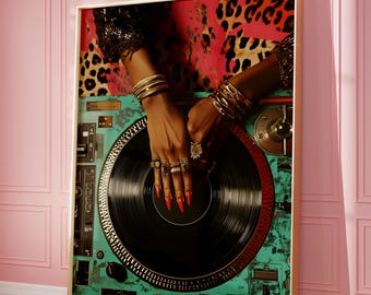 May include: A close-up of a DJ mixer with a hand on the turntable. The hand is wearing gold bracelets and rings. The mixer is green and has a black record on the turntable. The background is a leopard print fabric.