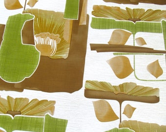 Puede incluir: Tela de patrón abstracto con fondo blanco y formas geométricas marrones y verdes. Las formas son flores estilizadas con un diseño de rayos de sol.