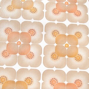 May include: A repeating pattern of brown and orange flower shapes on a white background. The flowers have a textured look and are arranged in a grid pattern.