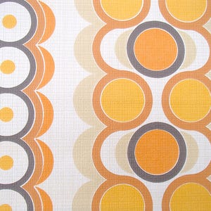 May include: A vintage wallpaper pattern with a repeating design of orange, yellow, and white circles on a white background.