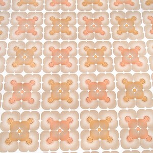 May include: A vintage wallpaper pattern with a repeating design of four-leaf clover shapes in shades of brown, orange, and peach on a white background.