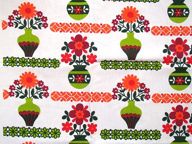 May include: A repeating pattern of stylised flowers in vases on a white background. The flowers are orange, red, and green. The vases are green with brown accents. The background is white with a repeating pattern of orange and green circles.